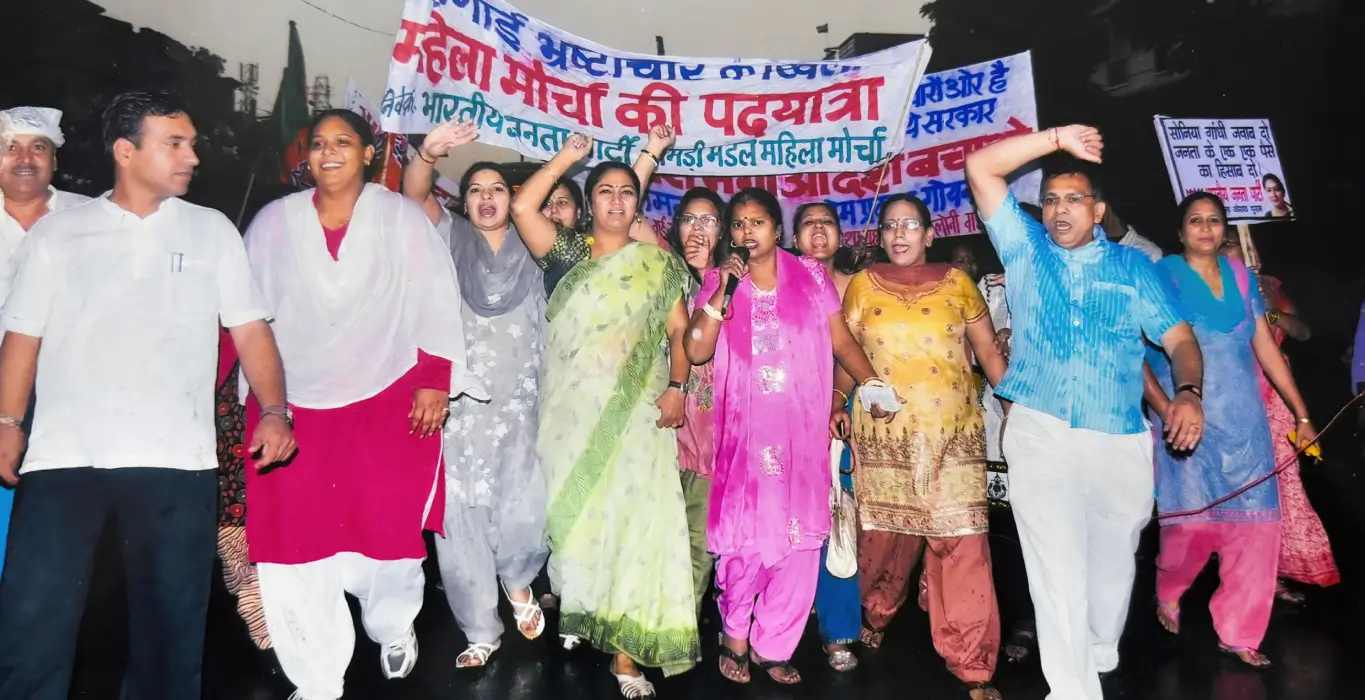 Rekha Gupta participating in a Mahila Morcha march against rising prices