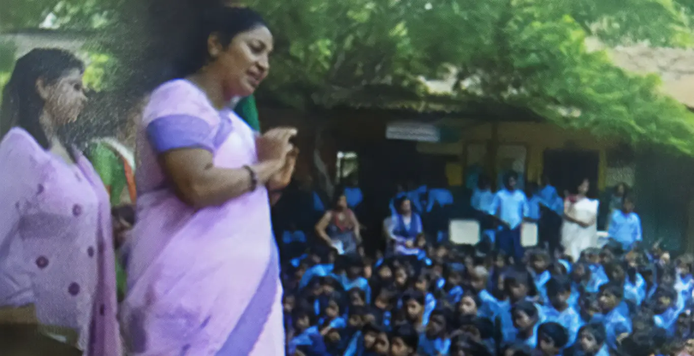 Rekha Gupta greeting students with folded hands during a school visit