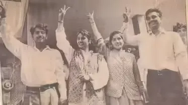 Archival photograph of Rekha Gupta and fellow student leaders raising victory signs